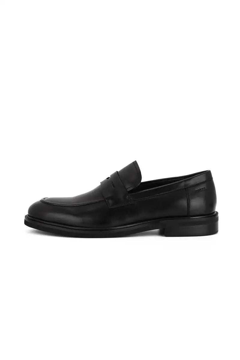 side view black penny loafer black shoes on white background