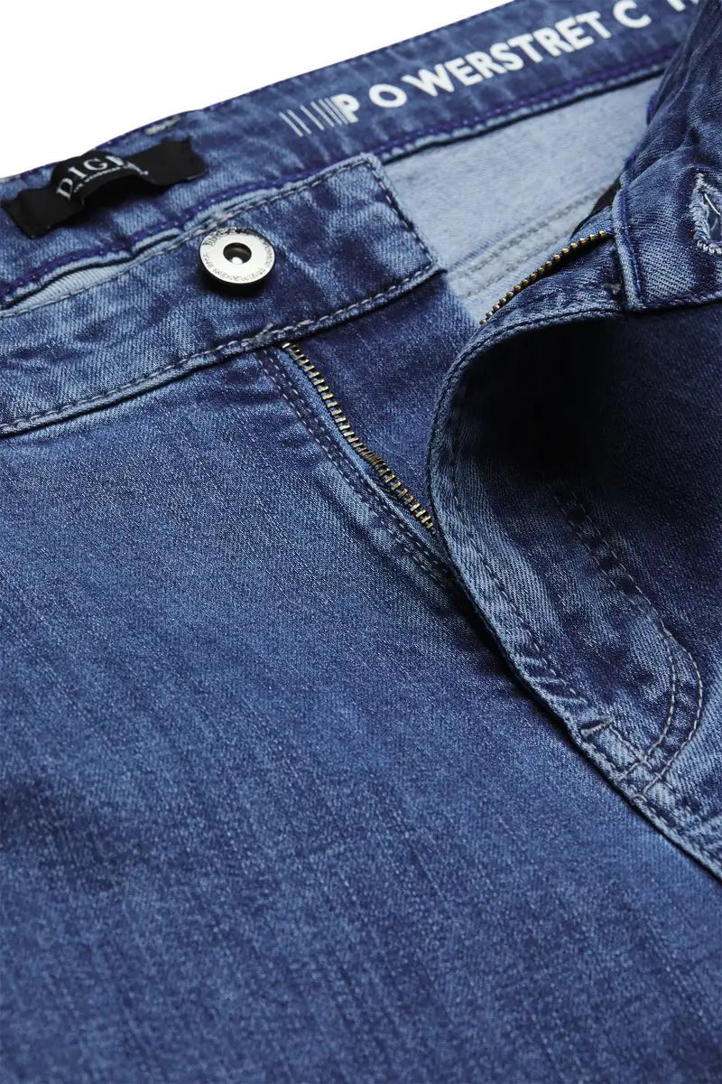 light blue jeans zipper close up on a white background