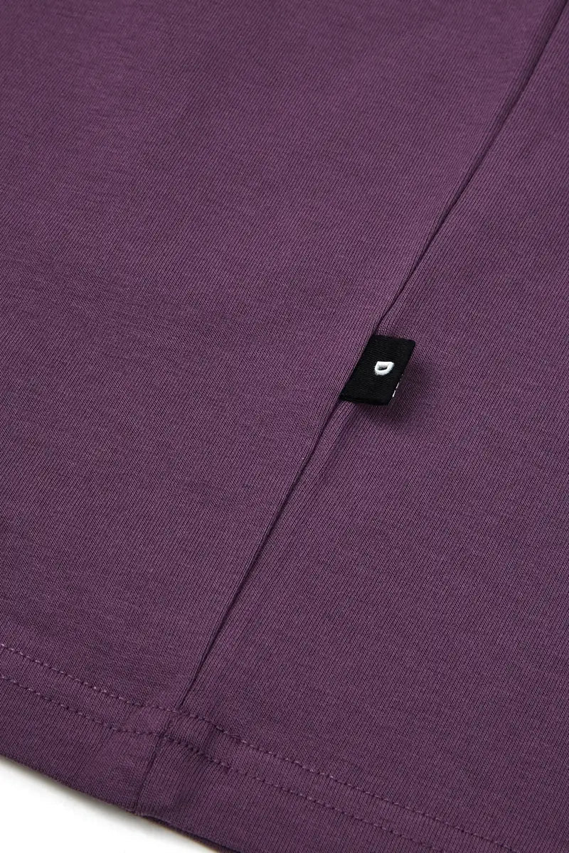 detail on side purple t shirt on white background