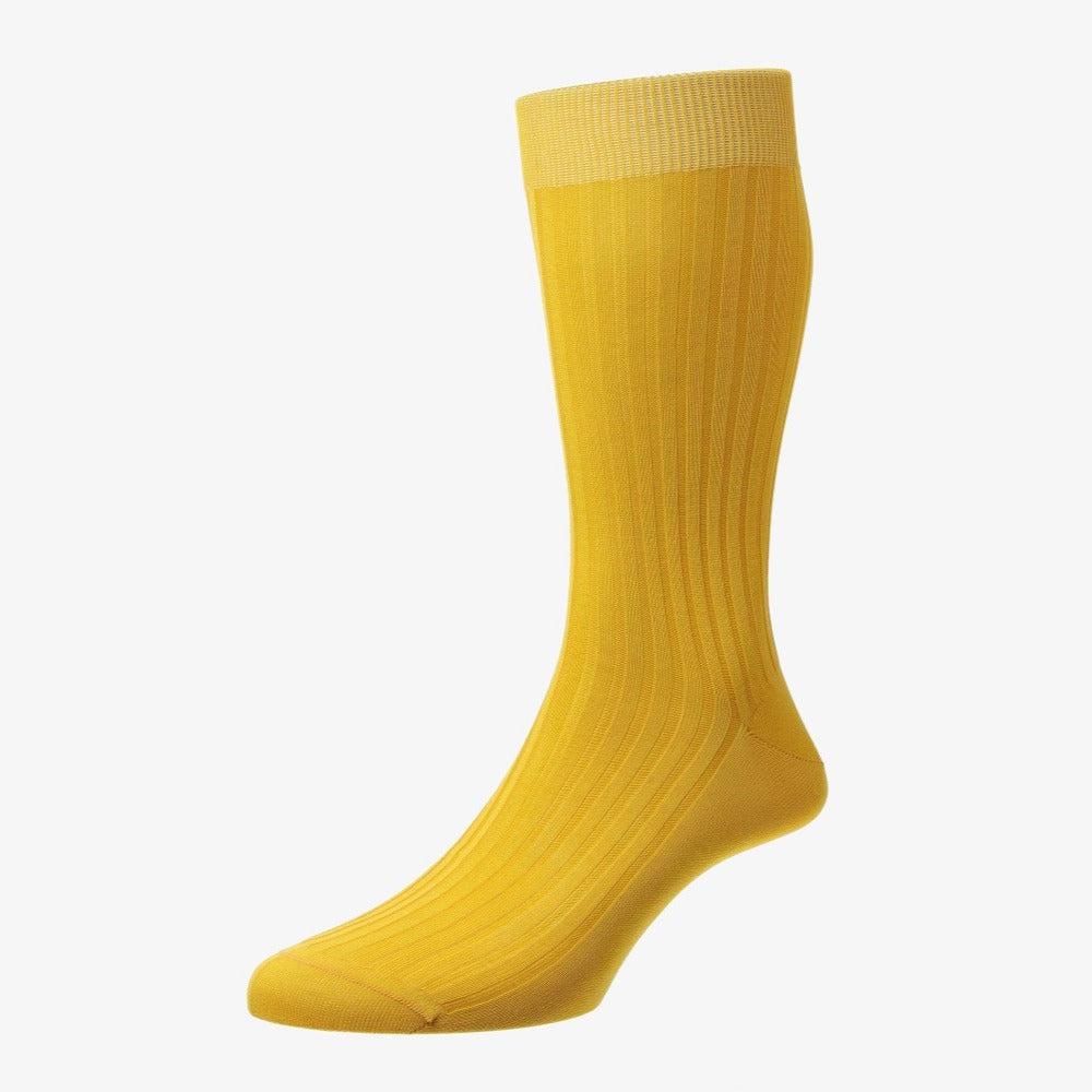 Yellow knee-high sock on a white background