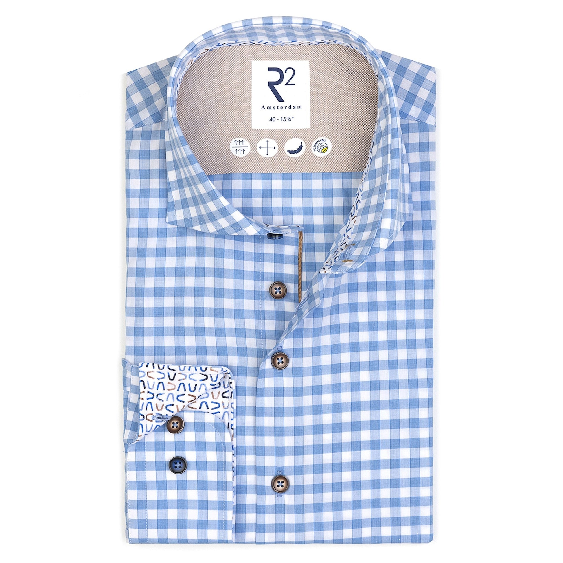 Blue and white checkered shirt with patterned pocket on a white background