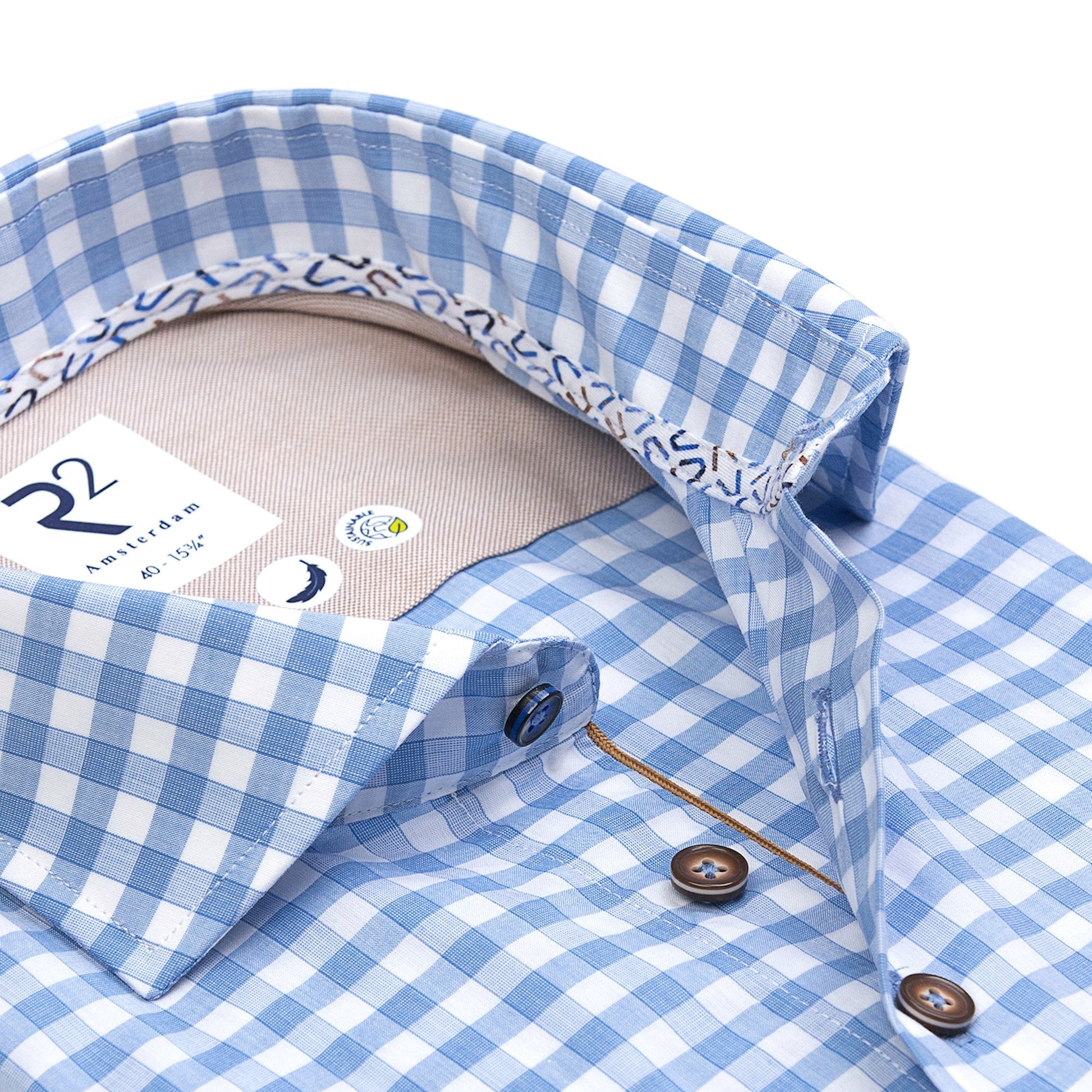 Blue and white checkered shirt with collar and buttons on a white background