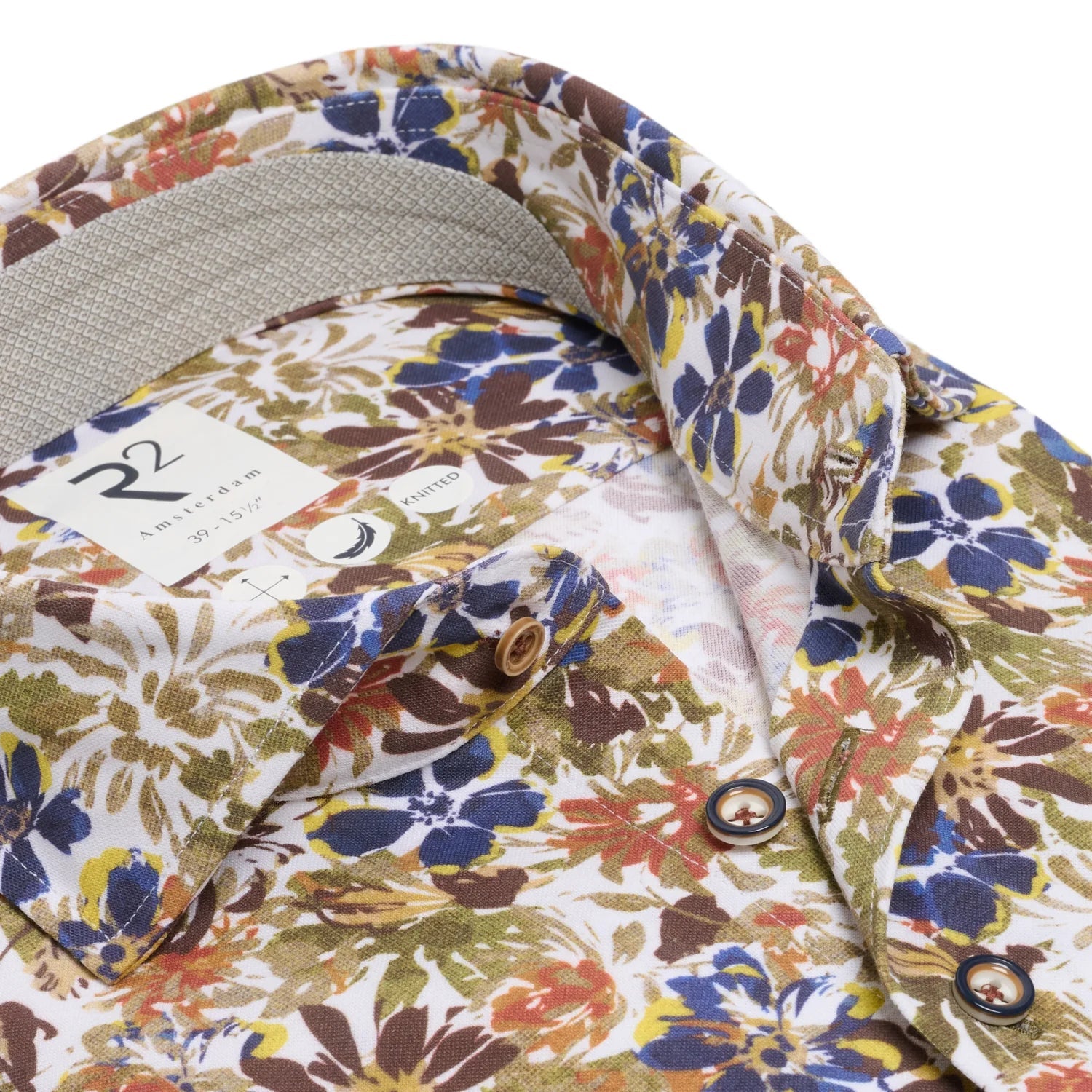 Floral patterned shirt with collar and buttons on a white background