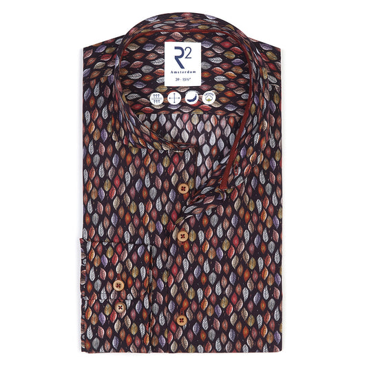 Folded patterned shirt with a brand label on a white background