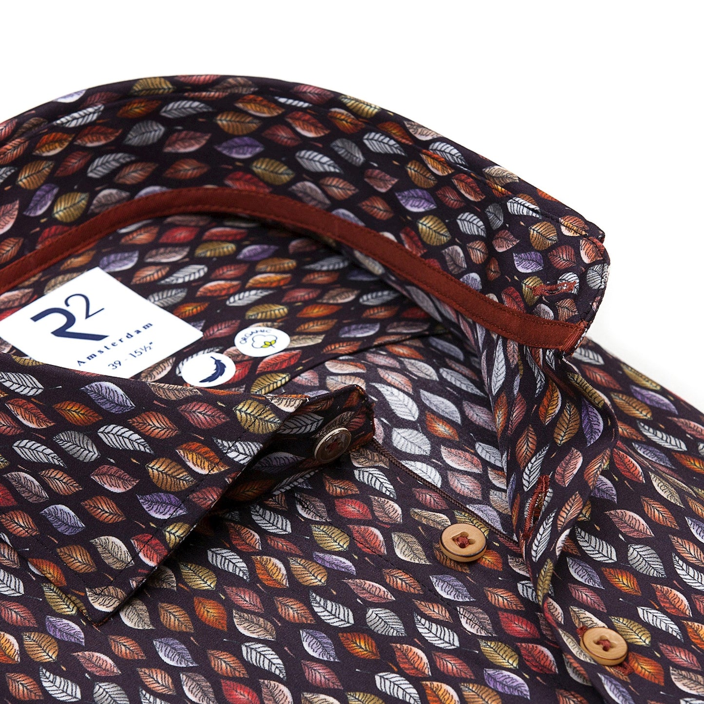 Folded shirt with a leaf pattern on a white background