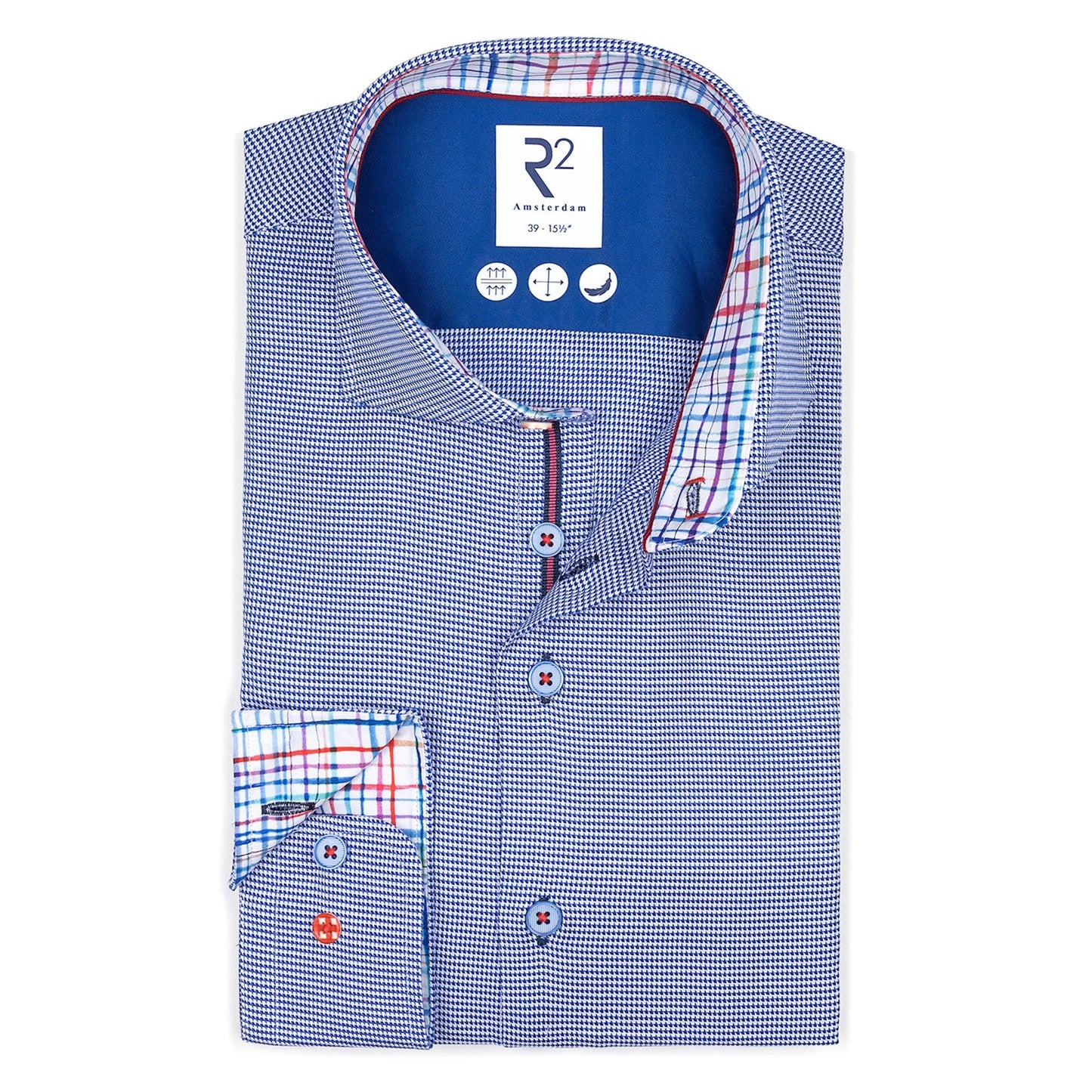 Folded blue checkered shirt with R2 branding on a white background