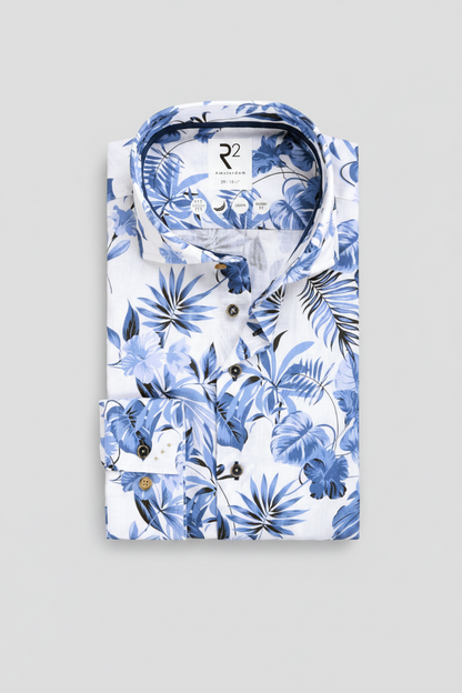 White shirt with blue floral pattern on a white background