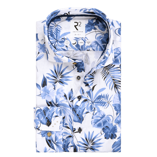 White shirt with blue floral pattern on a white background