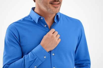 Man wearing a blue dress shirt against a white background