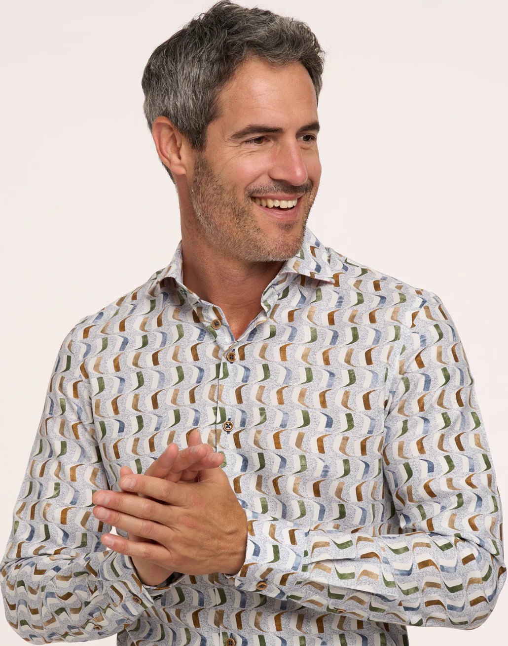 close up man in print dress shirt on white background