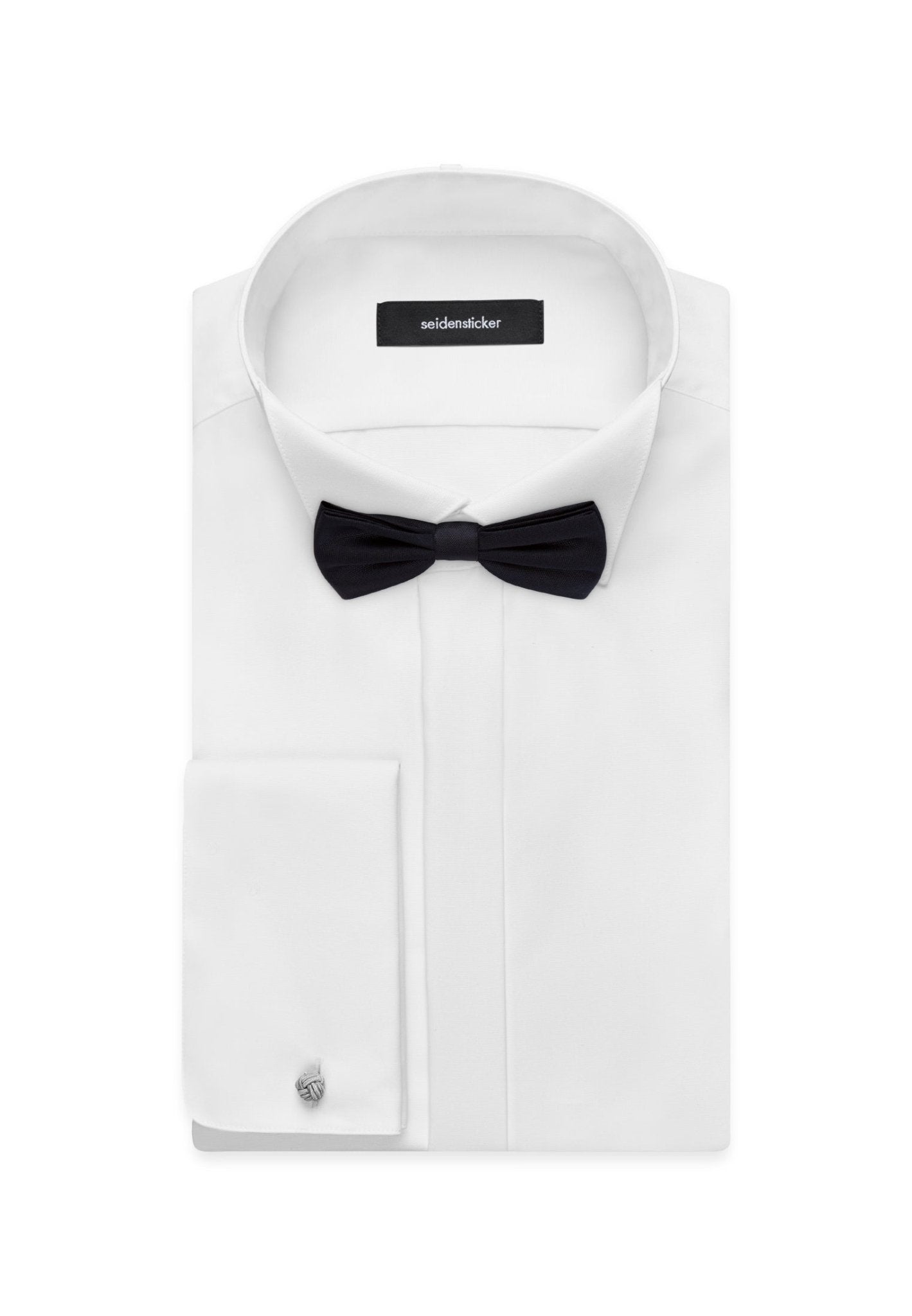 black bow tie on a white dress shirt on a white background