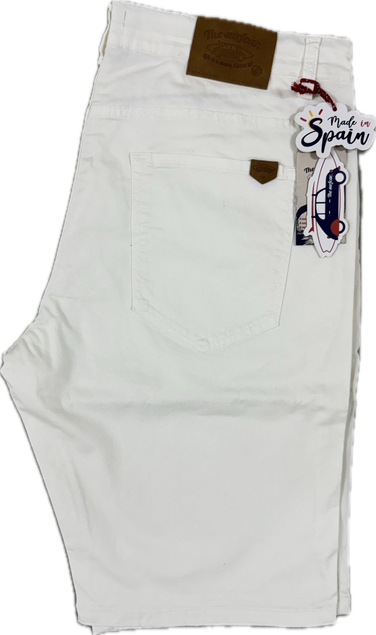White shorts with a brown label and 'Made in Spain' tag on a white background