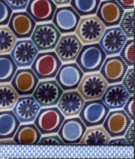 Close-up of fabric with geometric pattern featuring hexagons and circles in various colors.
