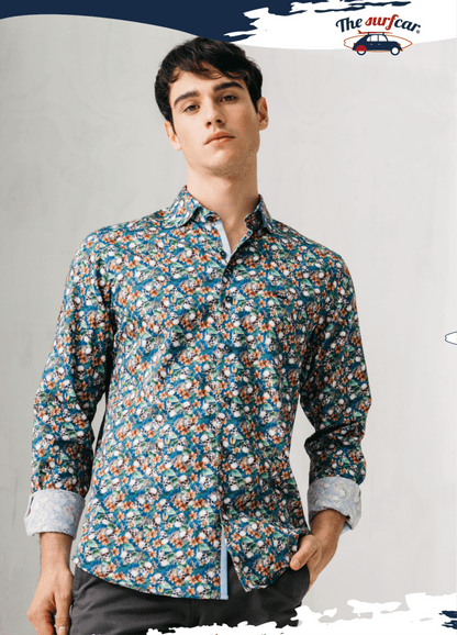 Man wearing a patterned shirt with a plain background