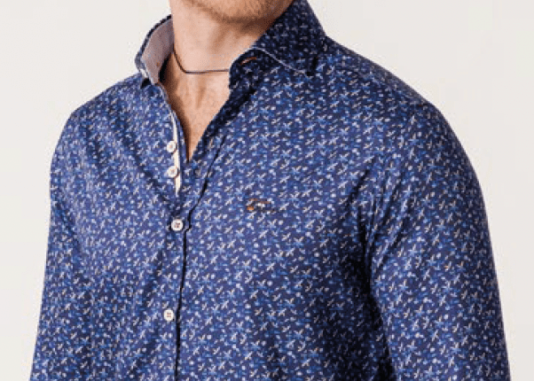 Blue patterned shirt worn by a person on a light gray background