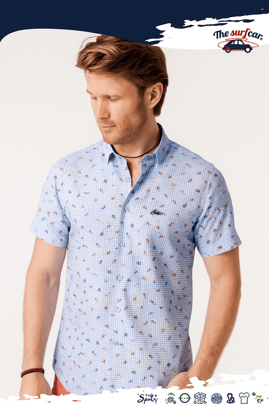 Man wearing a light blue patterned shirt on a white background